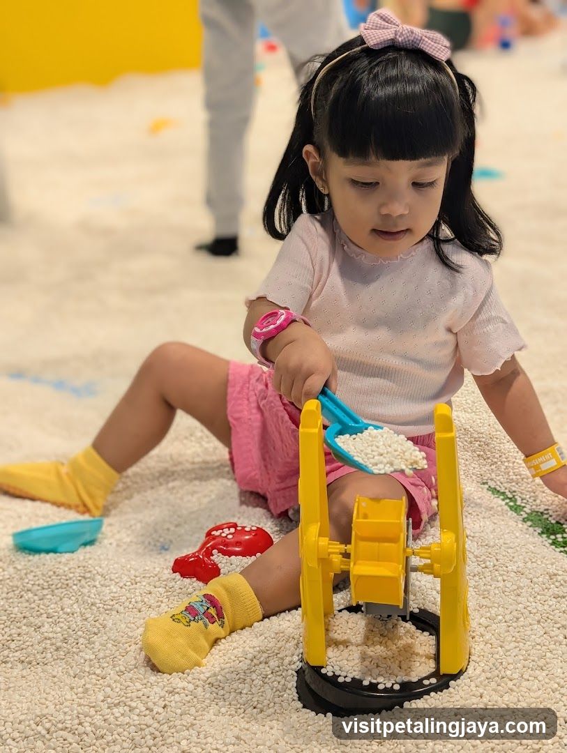 Child Playing with Sand Toys