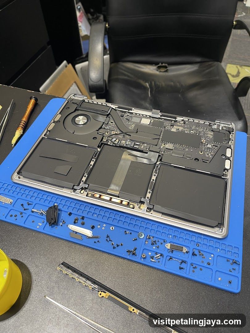Disassembled Laptop on Workbench