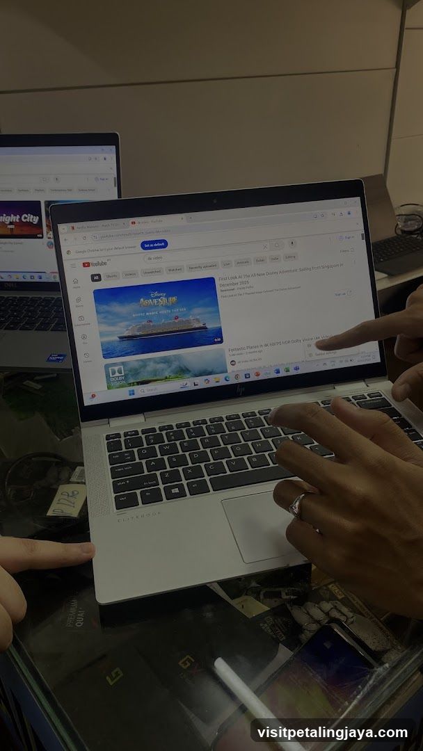 Laptops on desk with YouTube open