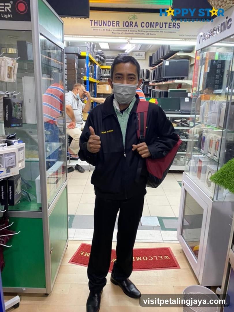 Man Giving Thumbs Up in Electronics Store