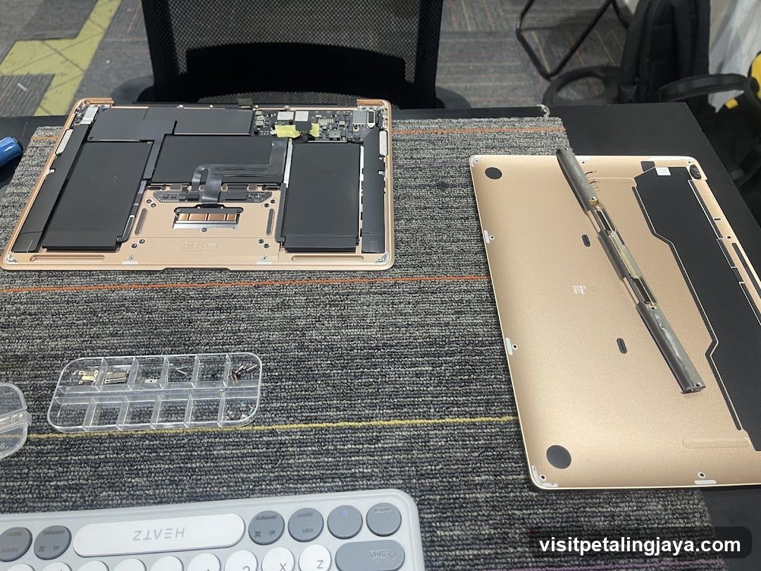 Disassembled Laptop on Desk