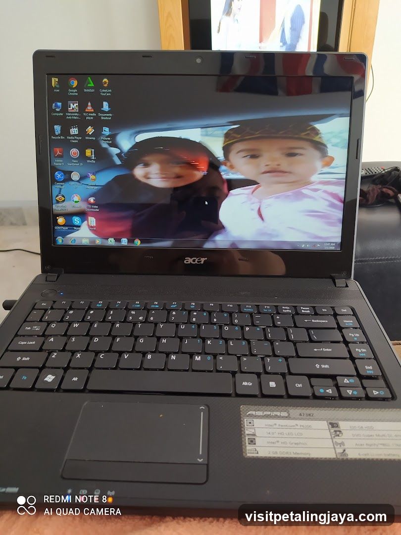 Acer Laptop Displaying Desktop with Photo Wallpaper
