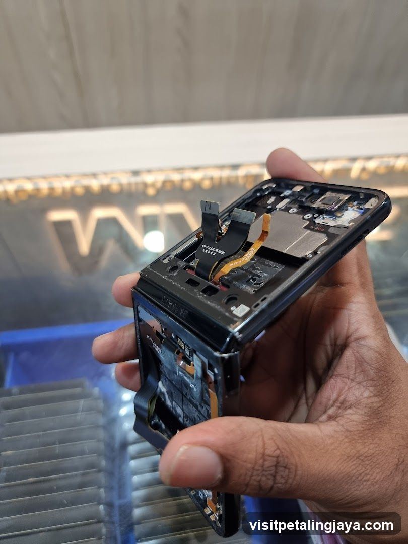 Disassembled Smartphone in Hand