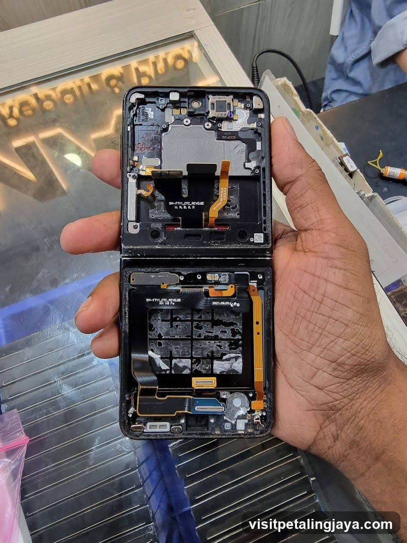 Disassembled Foldable Phone in Hand