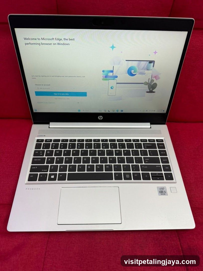 HP ProBook Laptop on Red Background