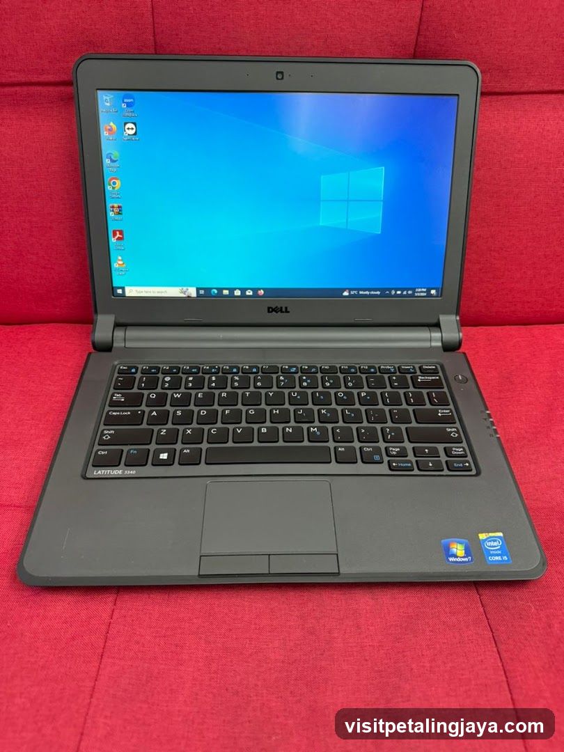 Dell Latitude Laptop on Red Fabric Surface