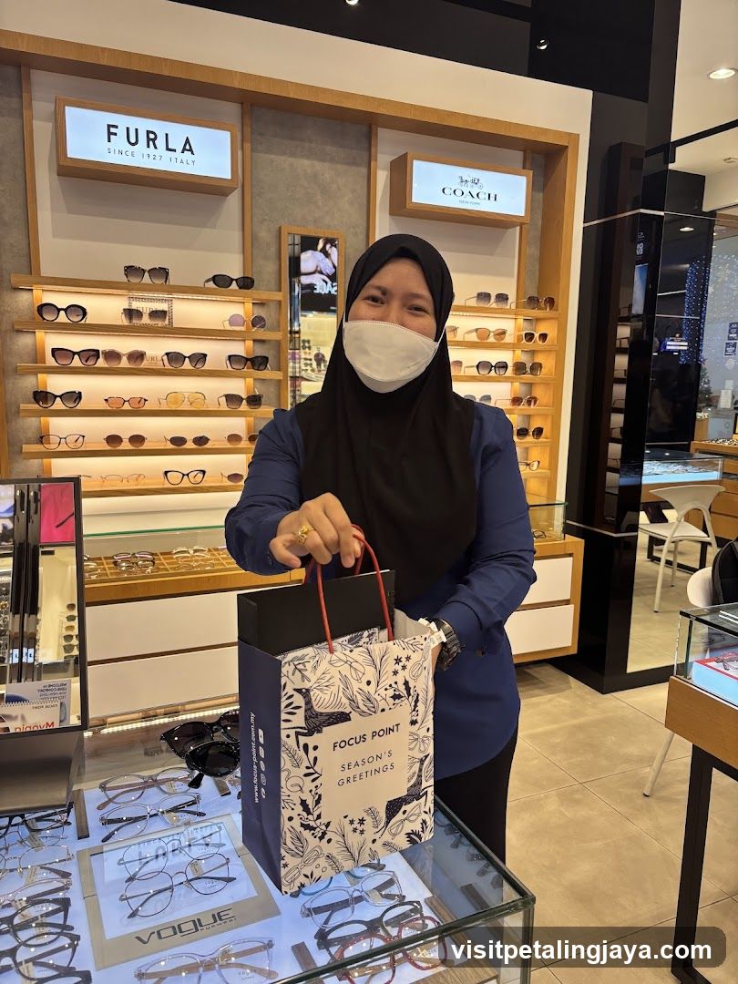 Eyewear Store Interior with Staff Holding Gift Bag