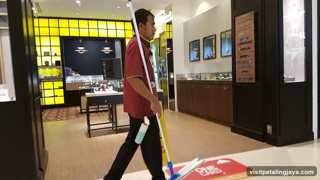 Cleaning Staff in Store Interior