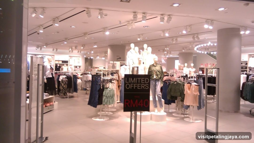 Clothing Store Interior with Limited Offers Sign