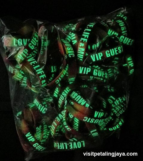 glowing green wristbands in a bag