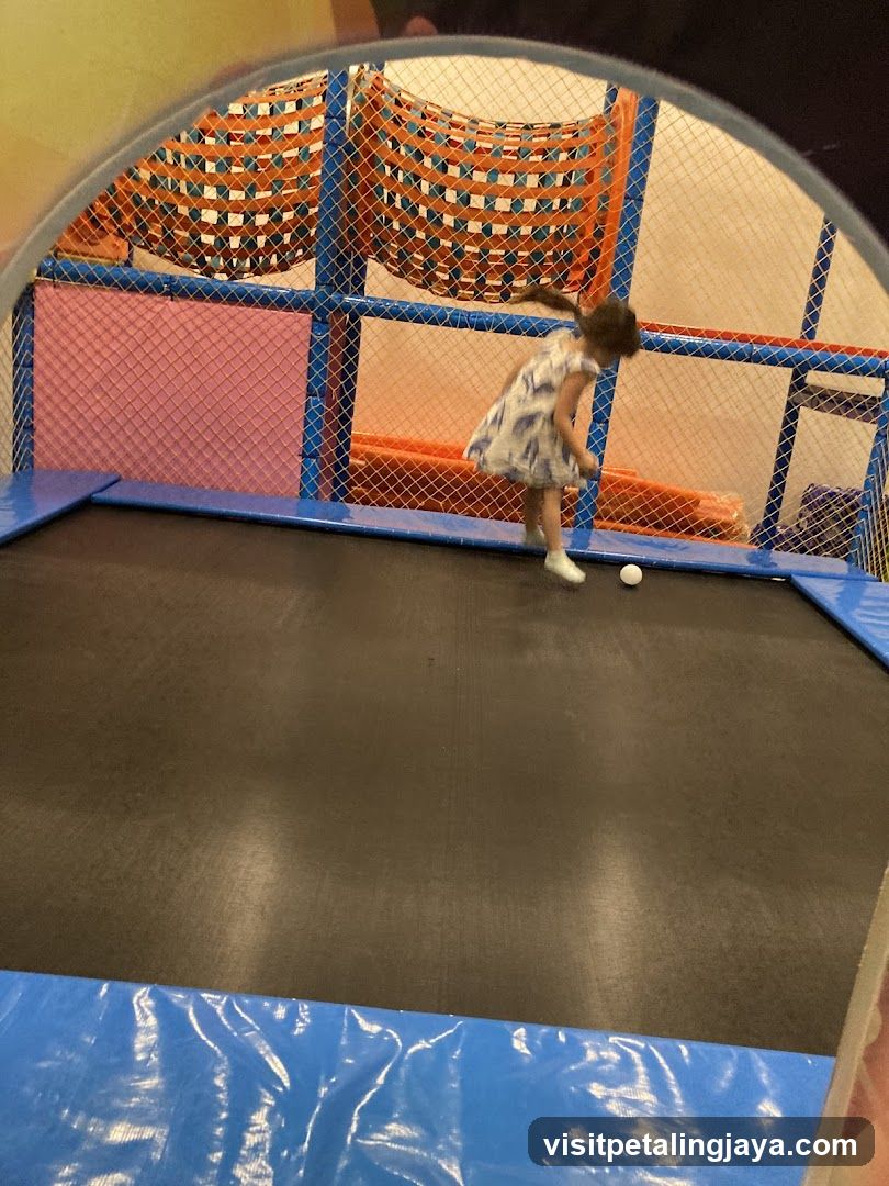 Child Playing in Trampoline Park