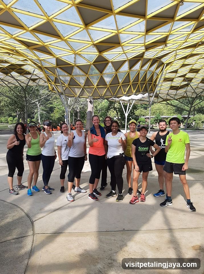 Group of people under a yellow canopy structure