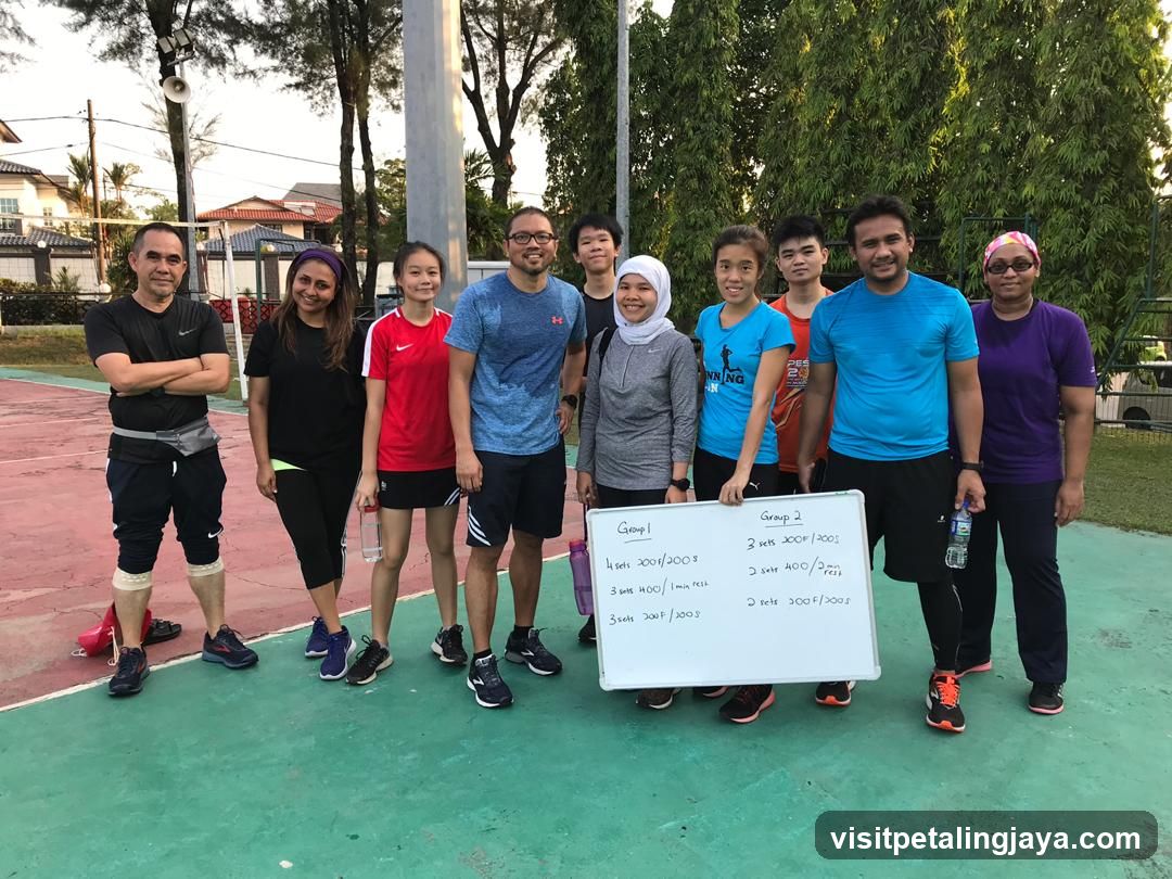 Group of people holding a whiteboard with workout schedule