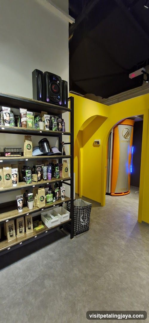 Interior of a coffee shop with product display and vending machine