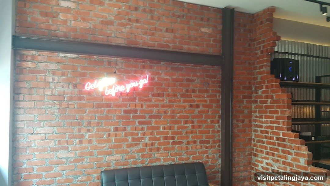 Neon Sign on Brick Wall