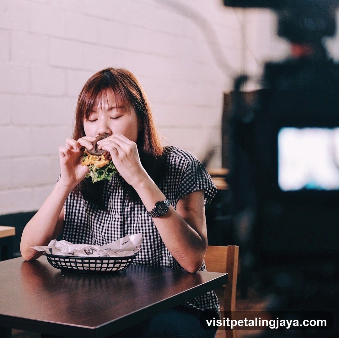 Woman Eating Sandwich in Cafe Interior