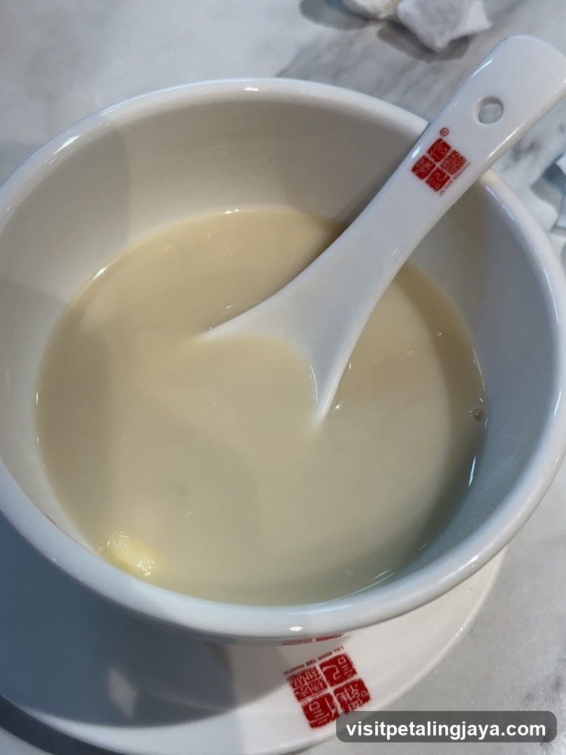 Bowl of creamy soup with spoon