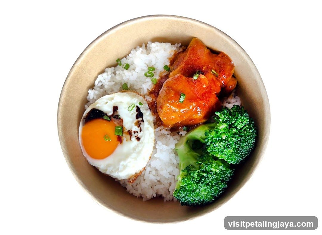 Bowl of Rice with Fried Egg, Broccoli and Meat