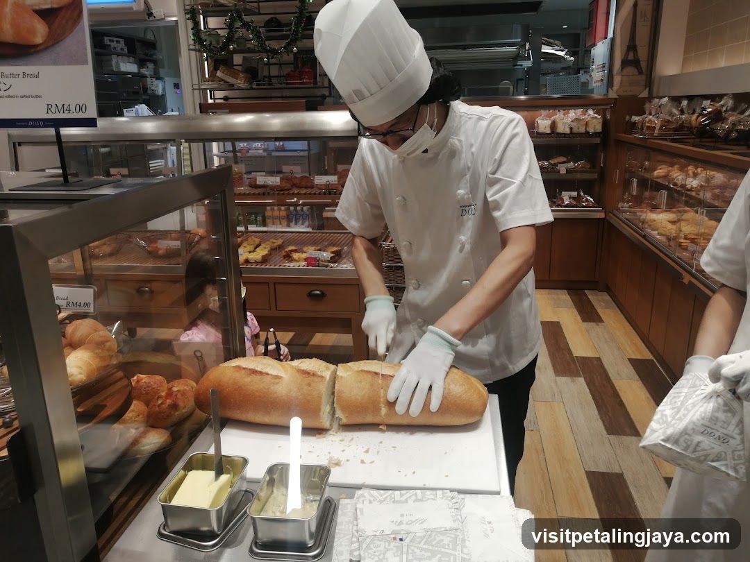 Bakery Interior with Staff Preparing Bread