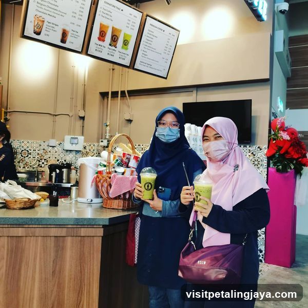 Customers with Green Smoothies at a Cafe
