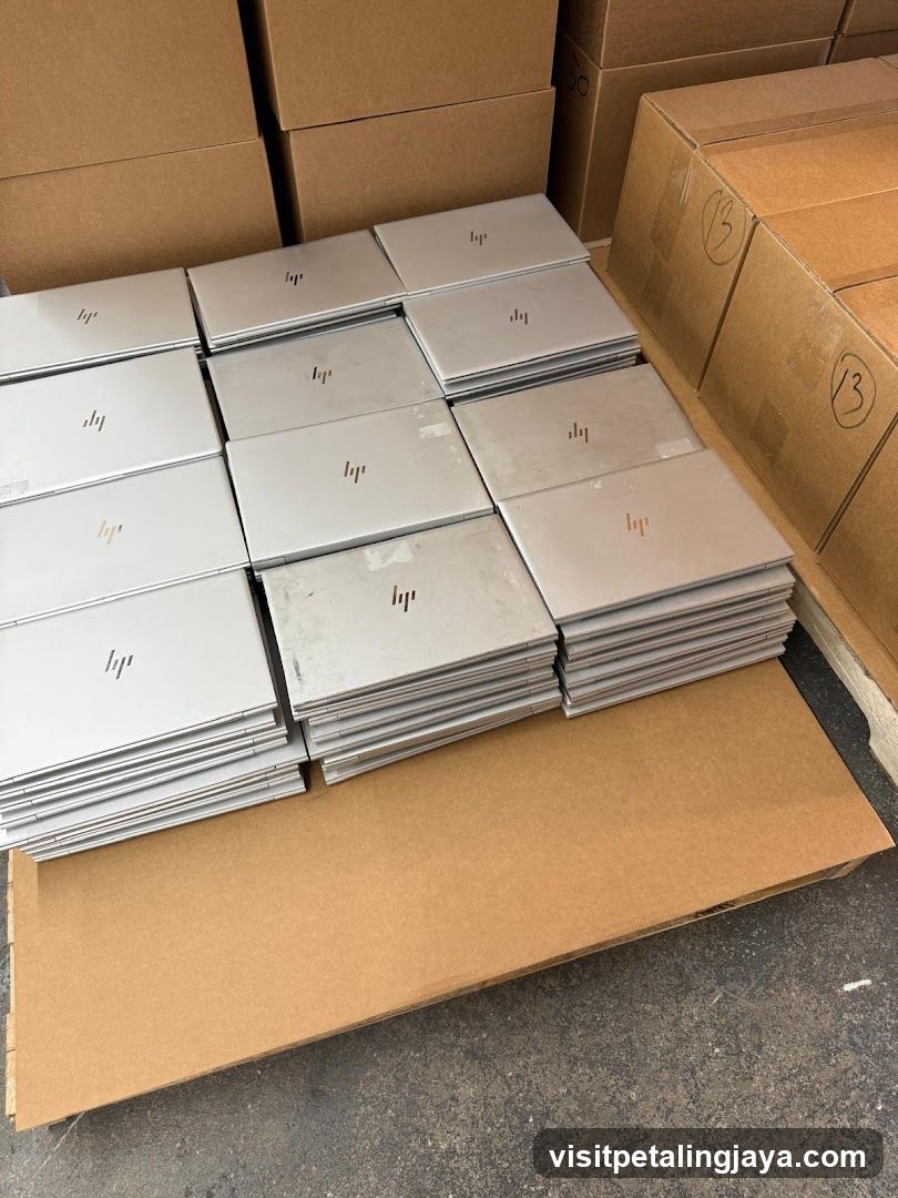 Stack of HP Laptops in Warehouse