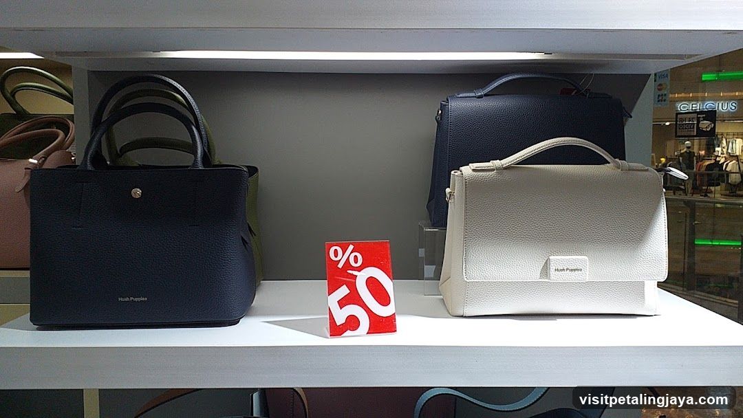 Handbag Display with Discount Sign