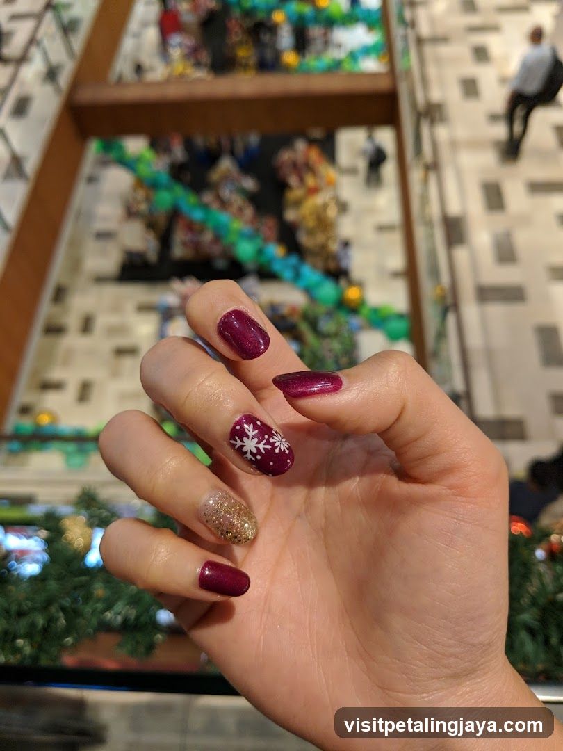 Christmas-themed manicure in a mall