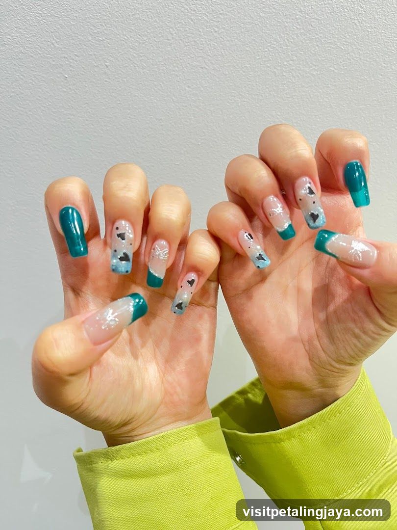 Teal and White Snowflake Nail Art