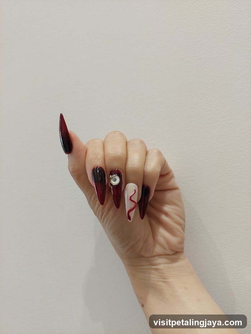 Dark Red Gradient Nail Art with Decorative Elements