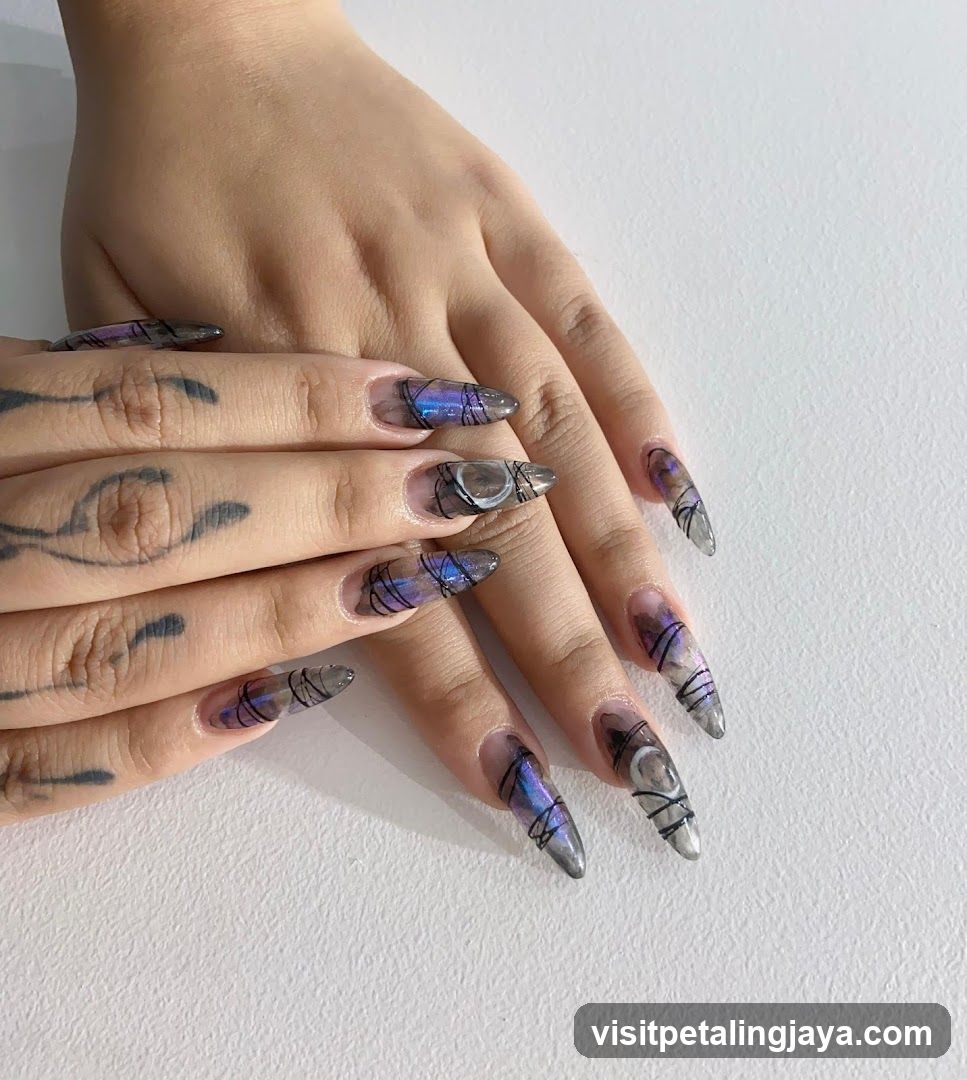 Artistic Nail Design with Purple and Black Patterns
