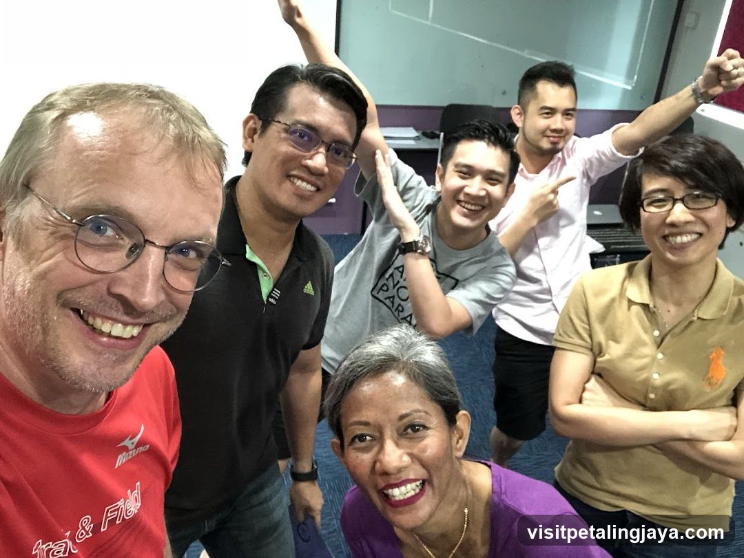 Group selfie in office or studio setting