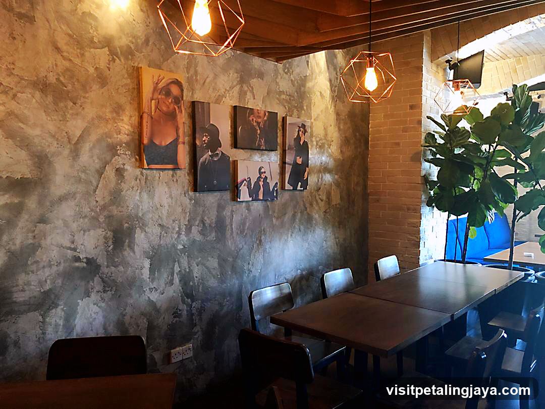 Interior Cafe with Art Wall and Wooden Tables