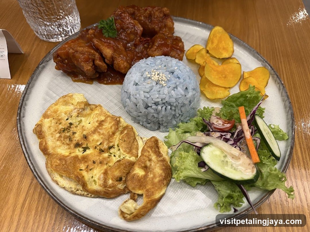 Blue Rice Plate with Fried Chicken and Omelette