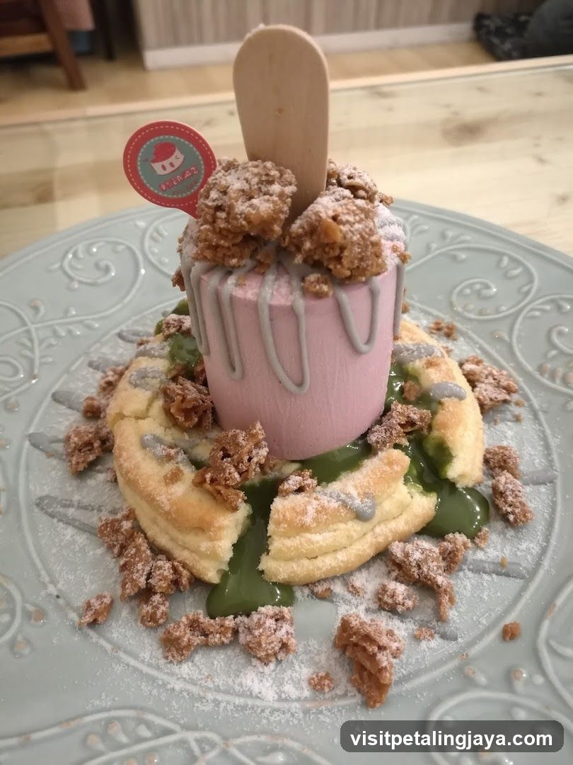 Dessert with Pink Mousse and Crumble Topping