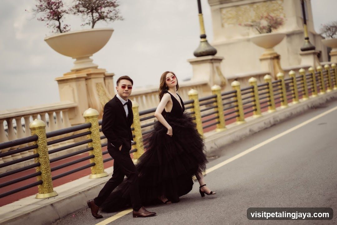 Couple in formal wear on a bridge