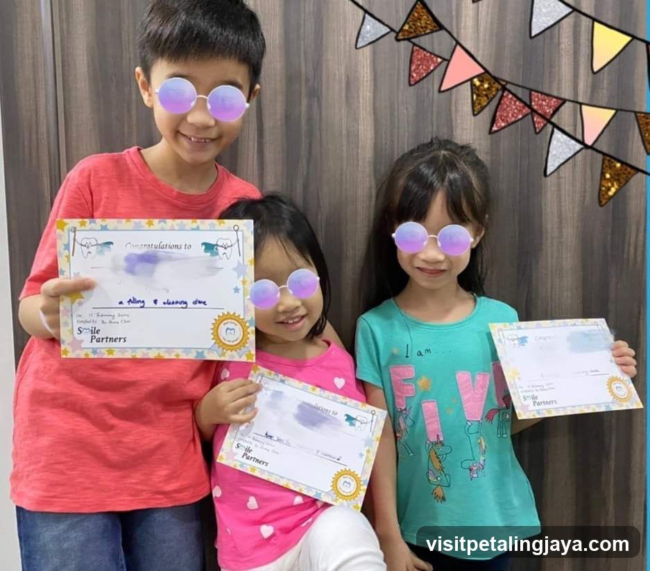 Children with certificates and sunglasses