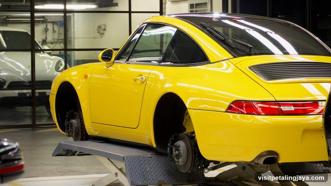 Yellow Porsche on Lift