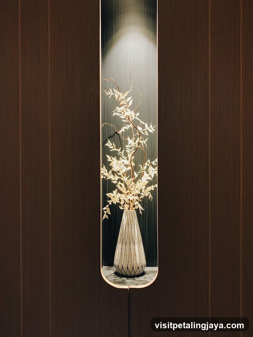 Wall-mounted vase with dried branches