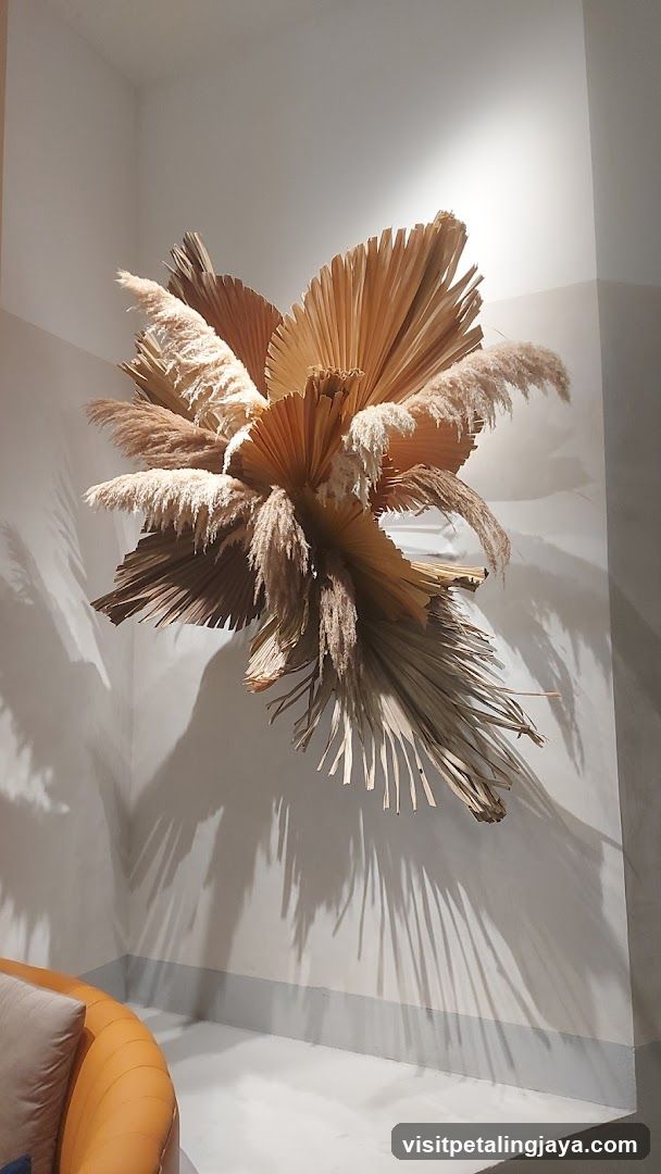 Wall-mounted dried plant sculpture