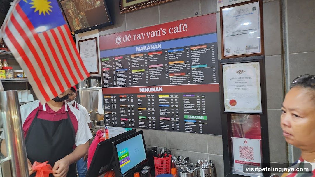 Cafe Interior with Menu Board and Staff
