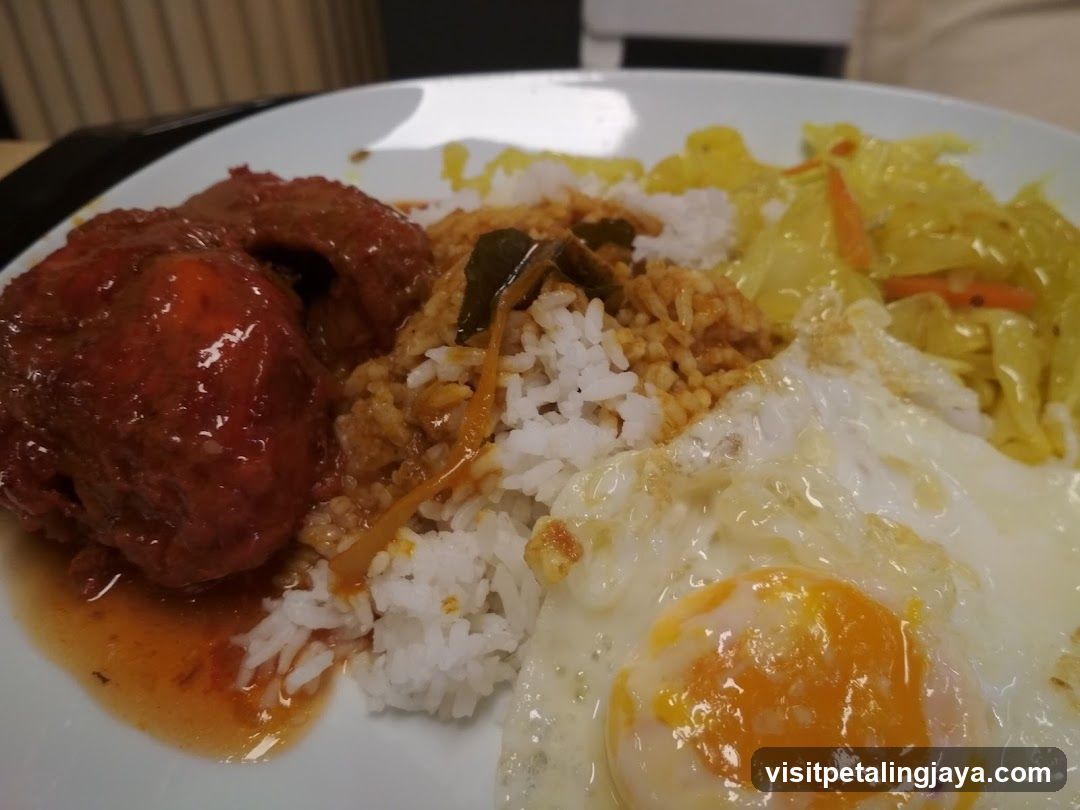 Plate of Fried Rice with Meatballs and Egg