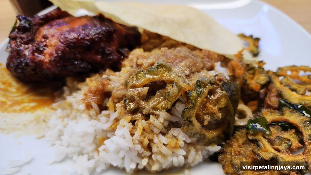 Plate of Indian Curry Rice with Fried Snacks