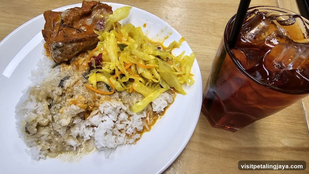 Plate of food with rice, meat, and side salad