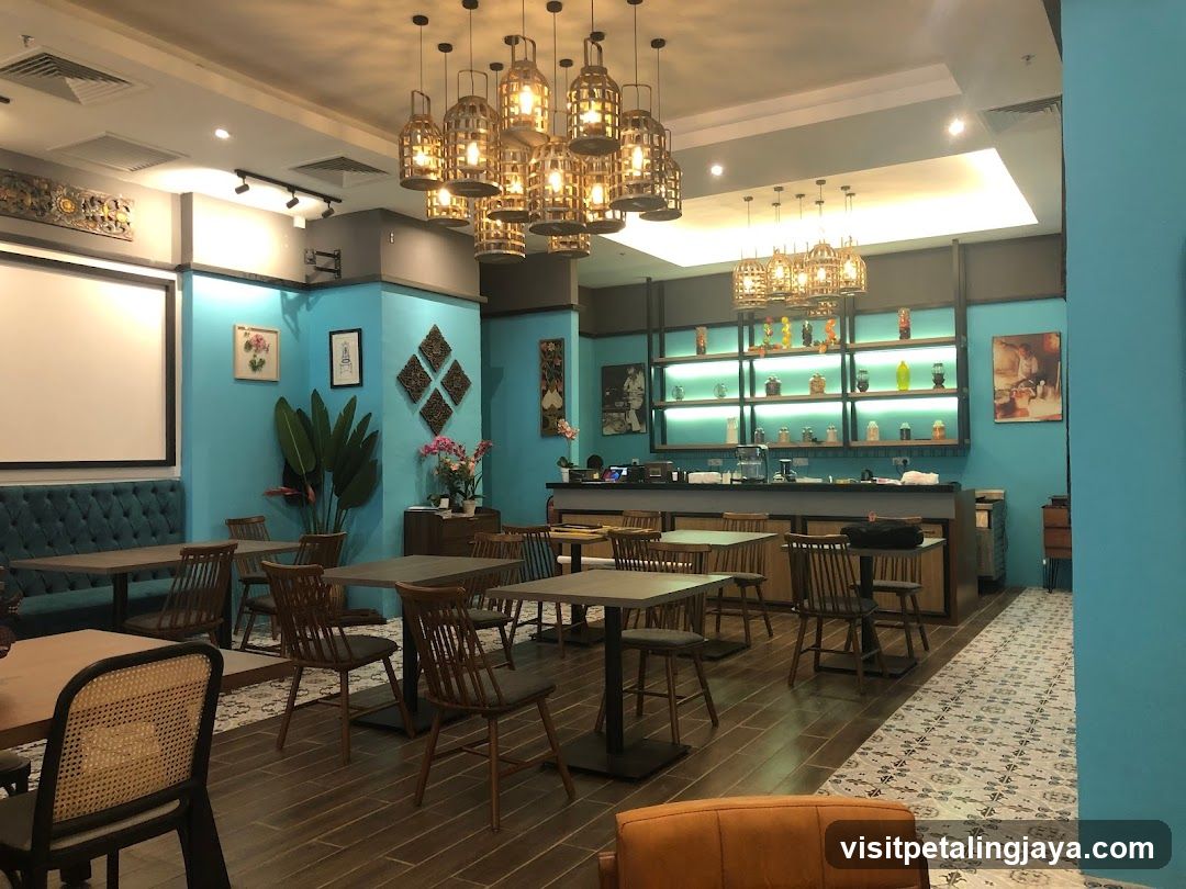 Interior of a modern restaurant or cafe with blue walls and wooden furniture.