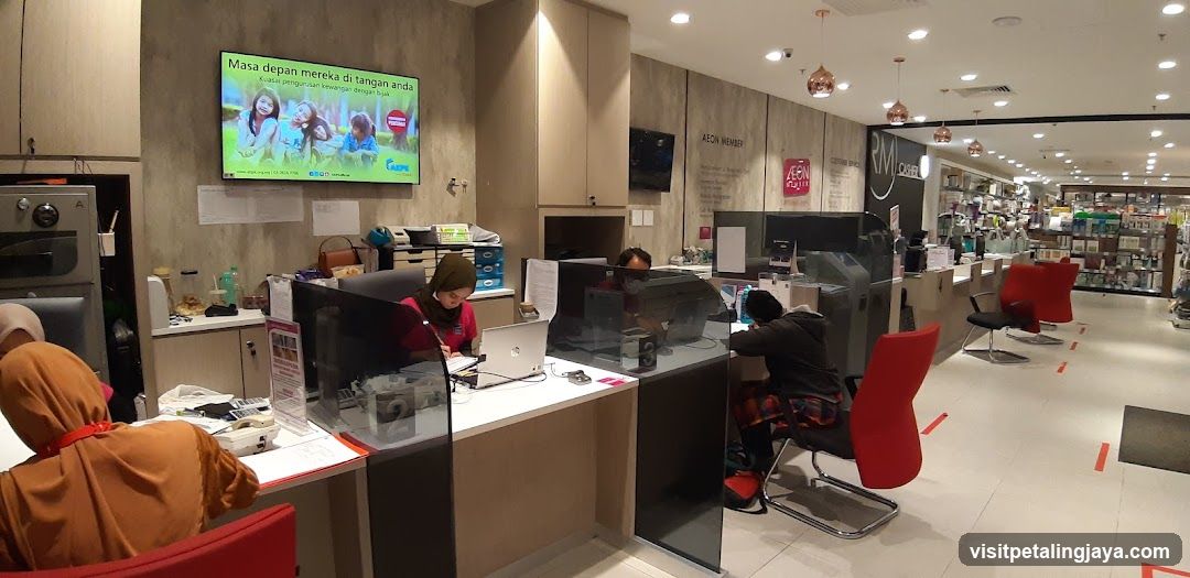 Interior of a retail store with service counters and digital displays