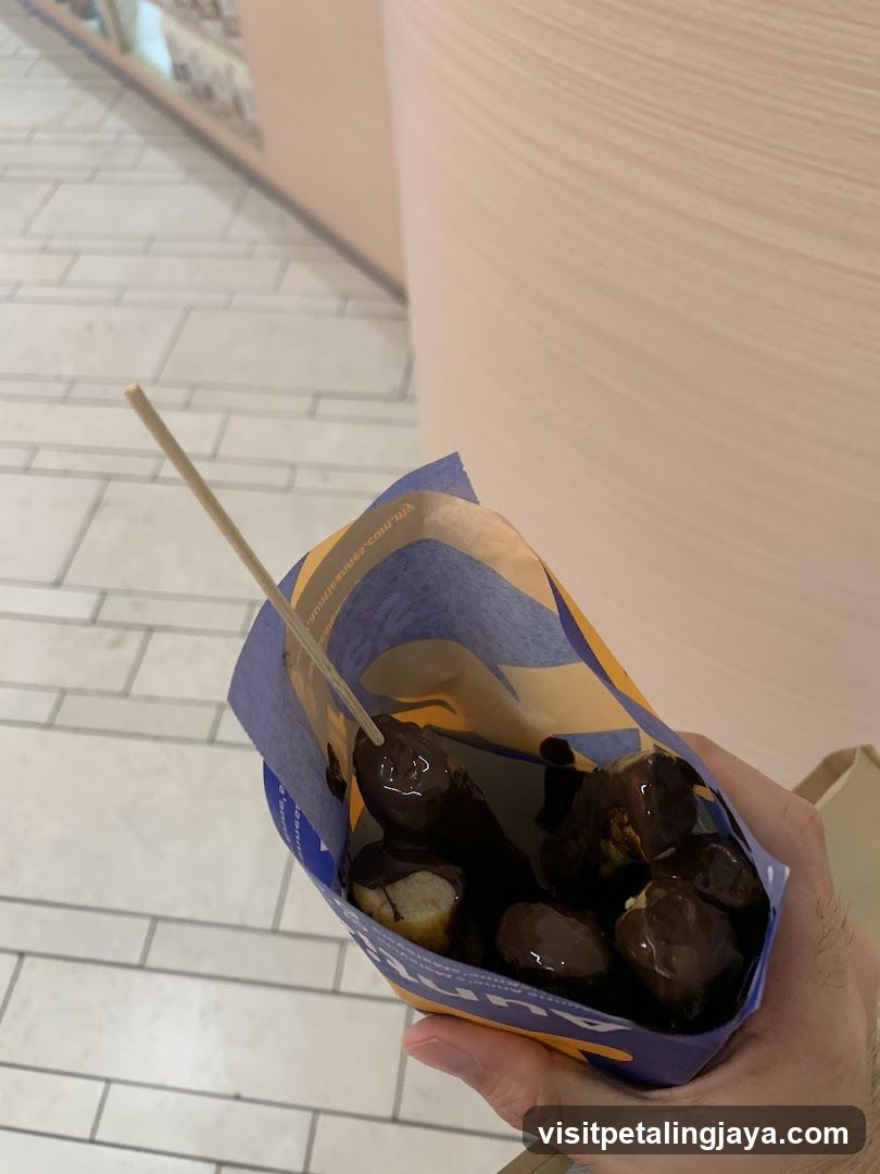 Chocolate-covered donut in a bag