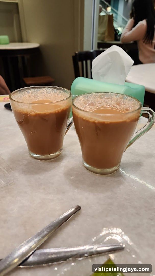 Two cups of iced coffee on a table