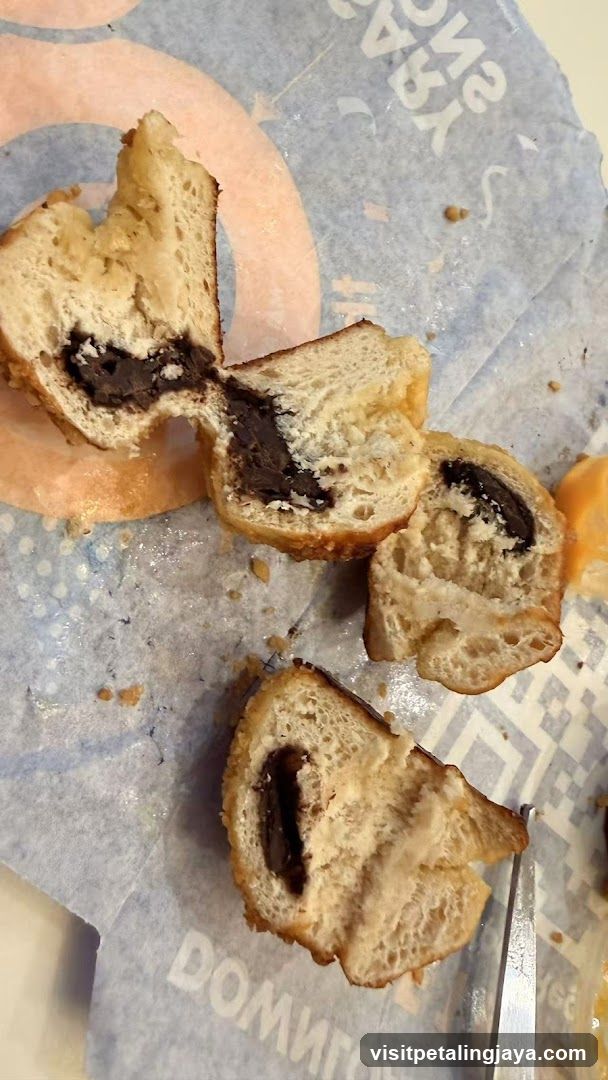Chocolate-filled pastry on branded paper