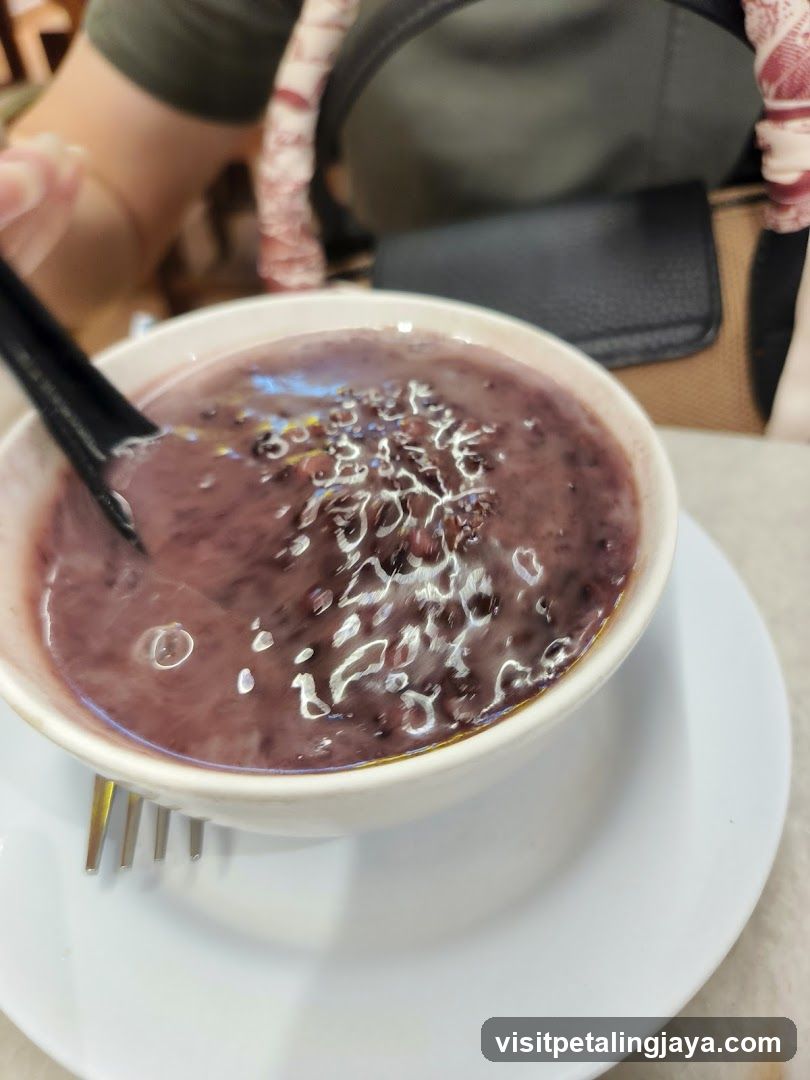 Bowl of Purple Porridge with Toppings