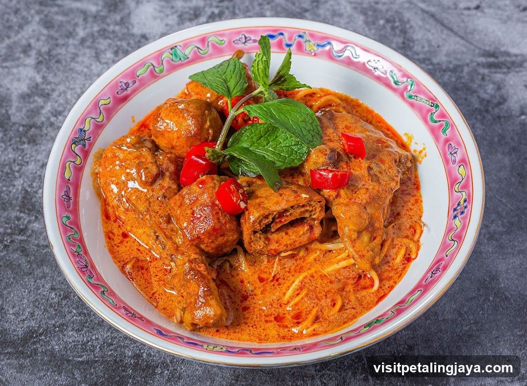 Curry Dish with Meatballs and Mint Garnish